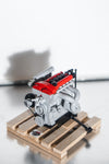 Red Mazda Miata B6 lego engine with wooden pallet side view